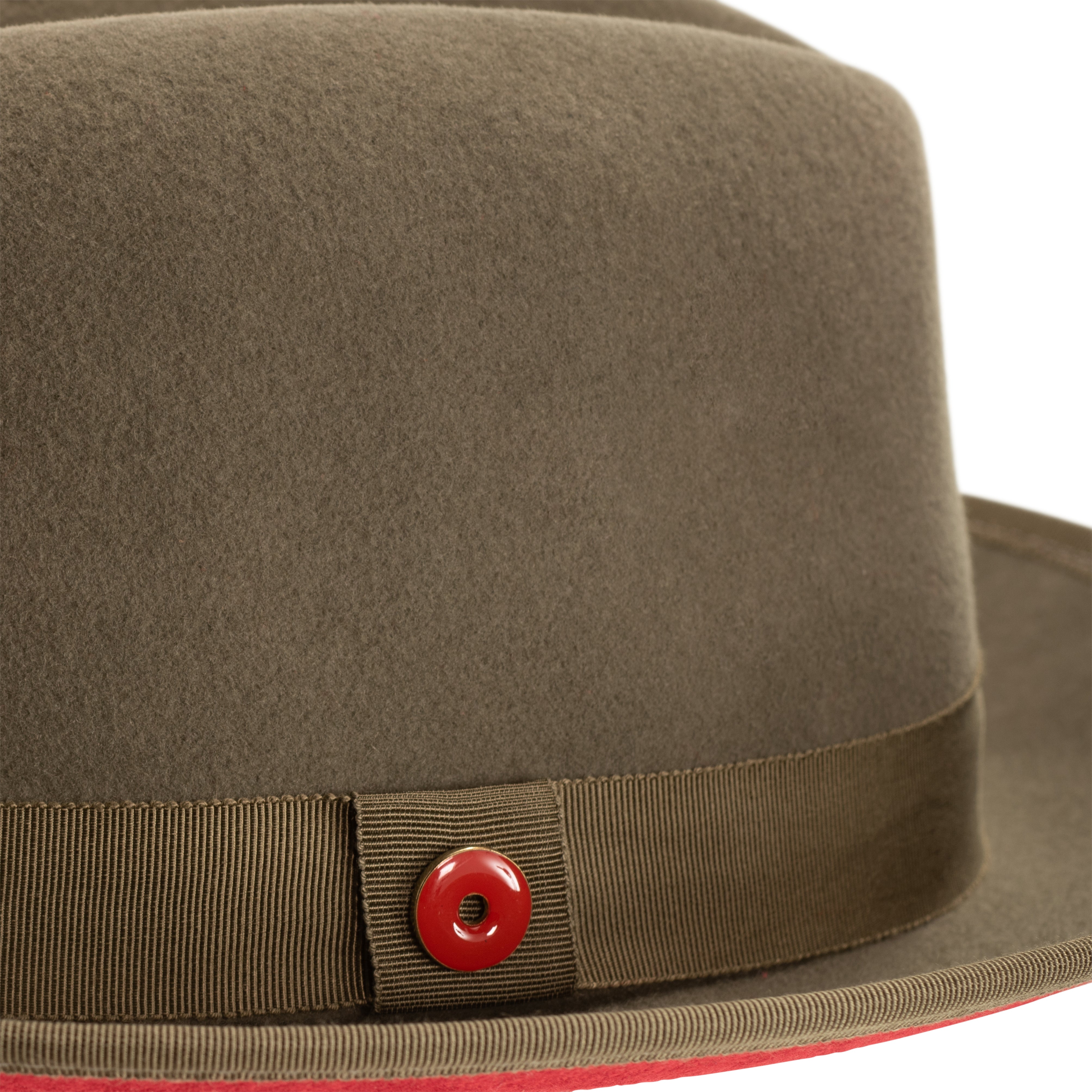 An olive green classic center-creased fedora with a red bottom brim and a signature logo pin on the side.