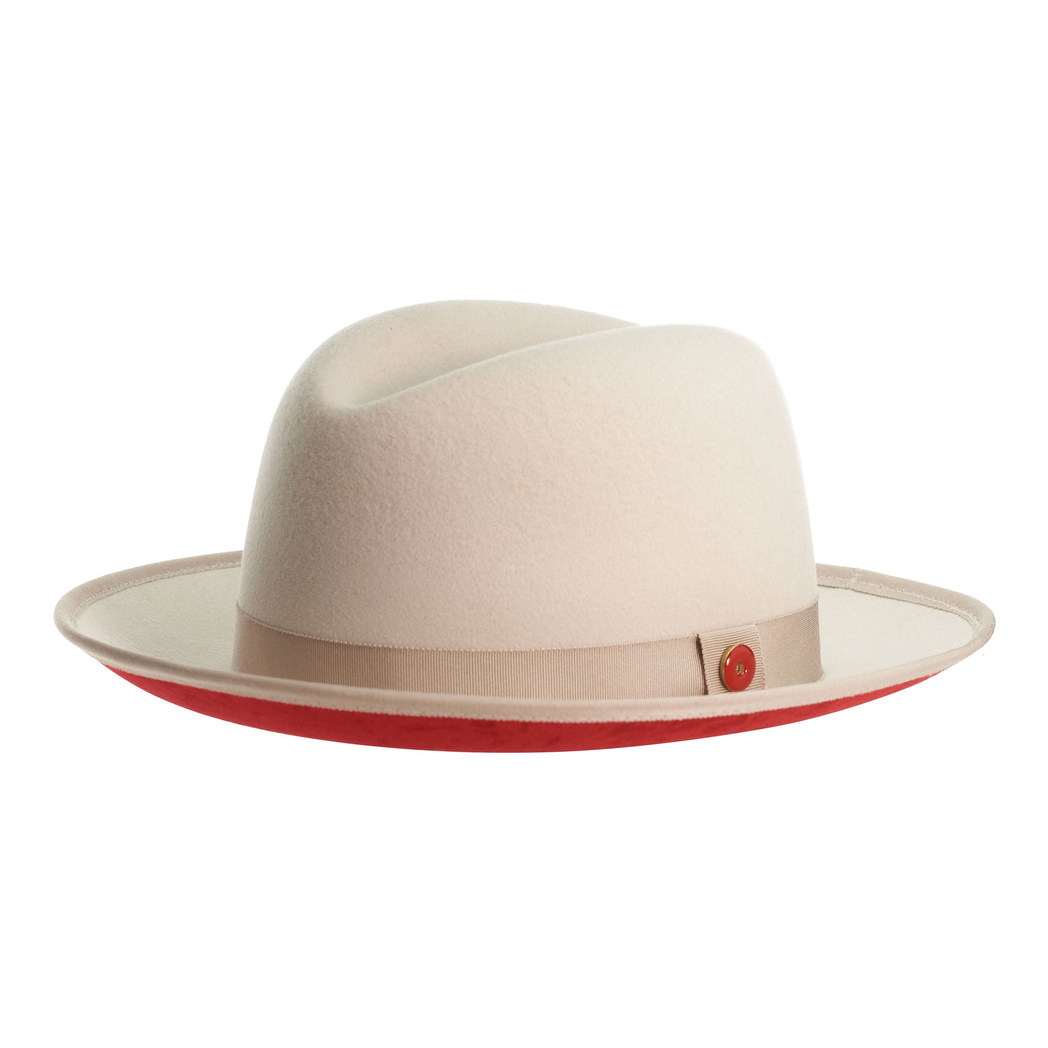 A sandy beige fedora with a red bottom brim and a signature logo pin.