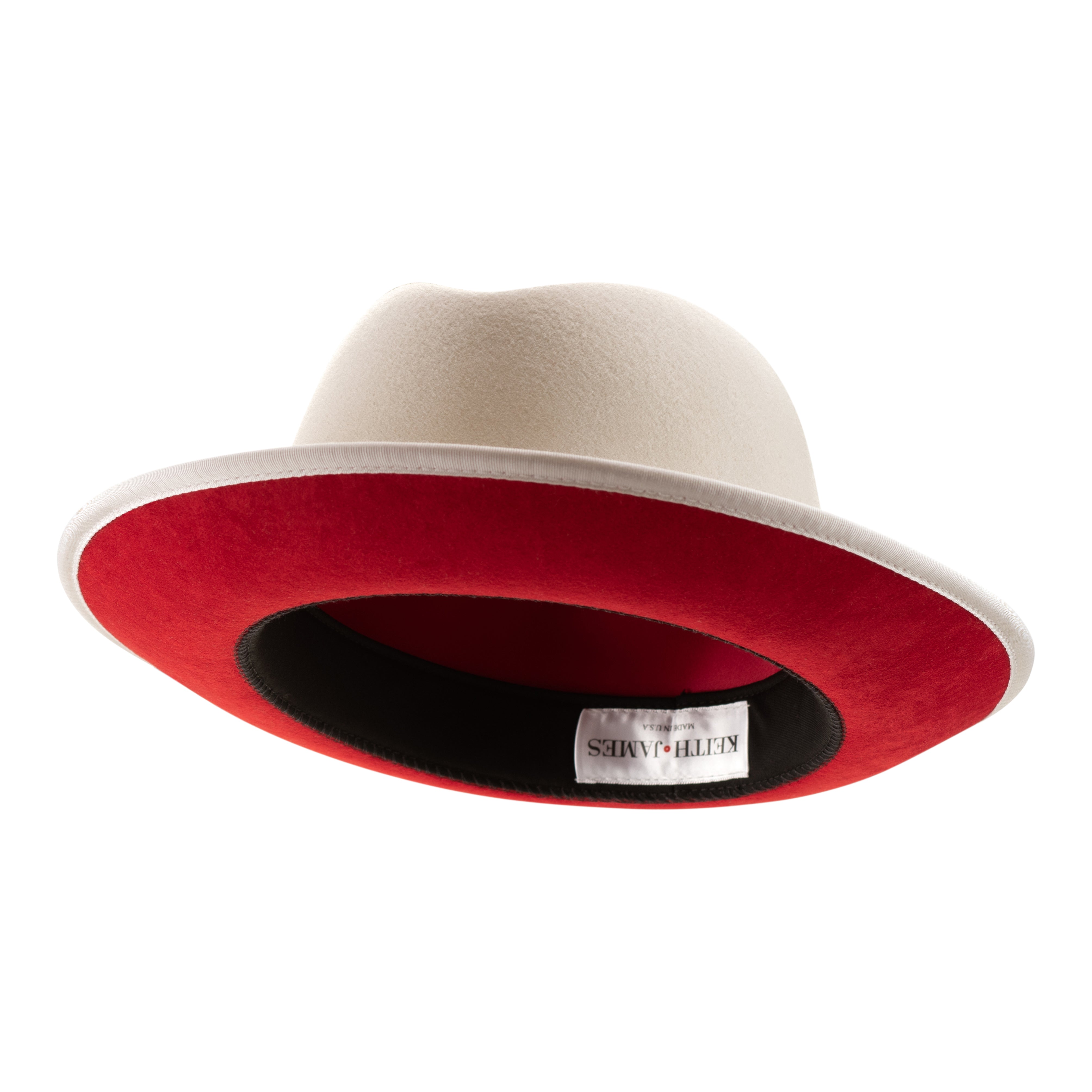 A snow white fedora hat with a red bottom brim and a signature logo pin.