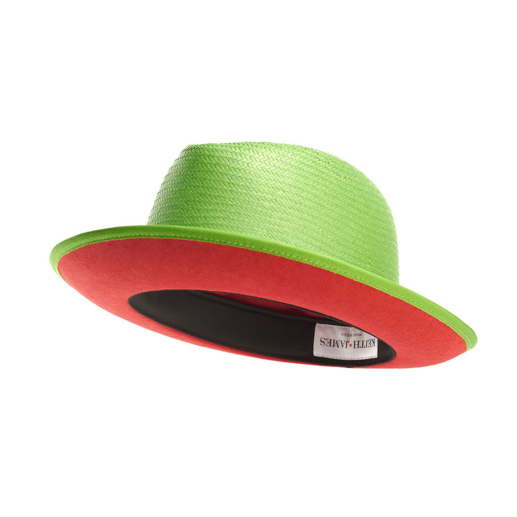 A lime green straw fedora with a red bottom brim and a ribbon trim around the base.