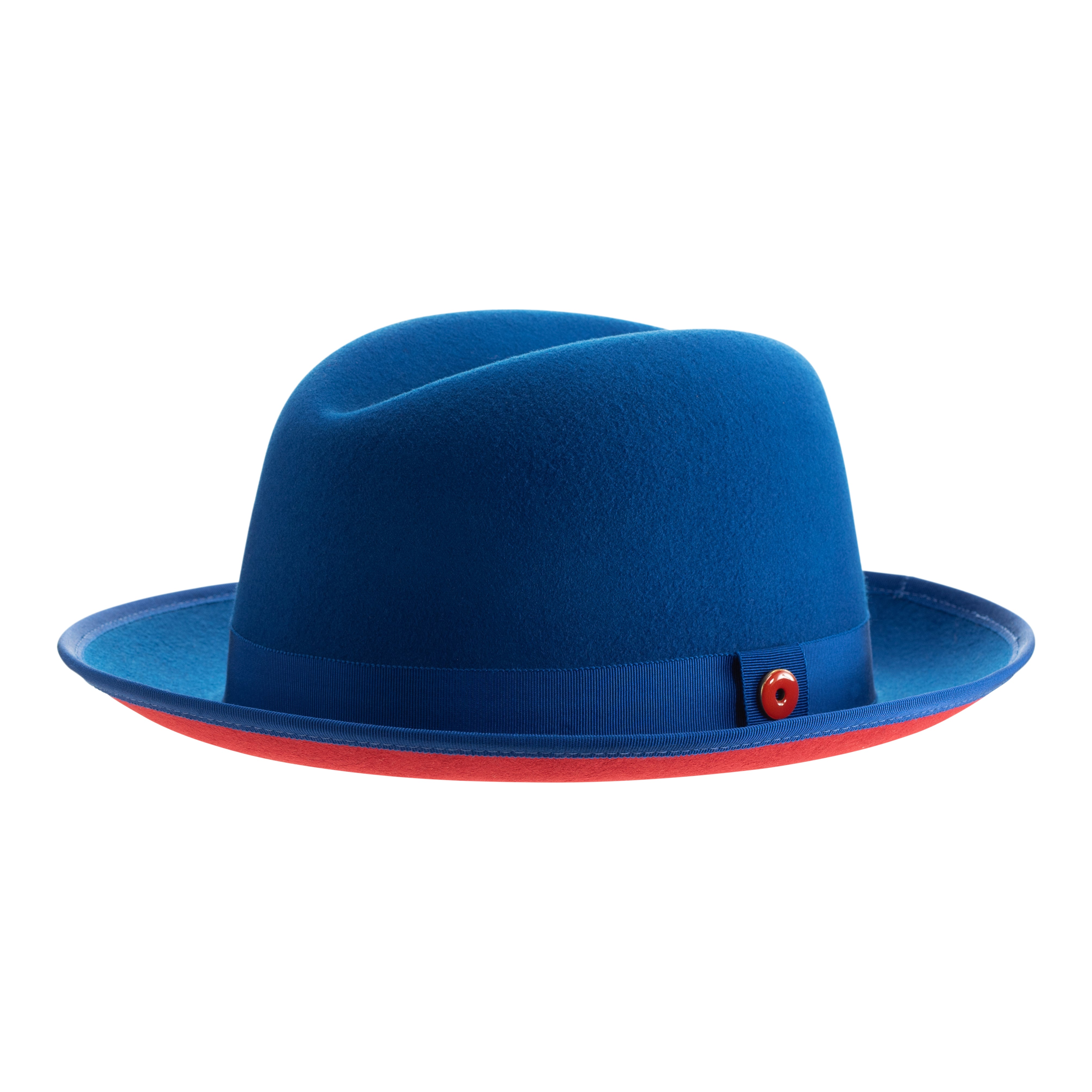 A blue fedora hat with a red bottom brim and a signature logo pin.