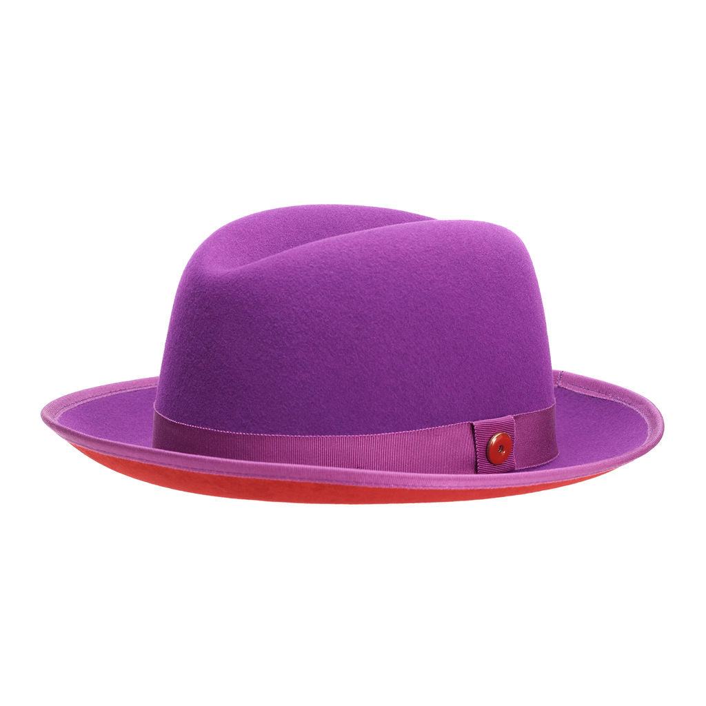 A violet purple classic center-creased fedora with a 2.5 inch curved brim, signature logo pin, and red bottom brim.