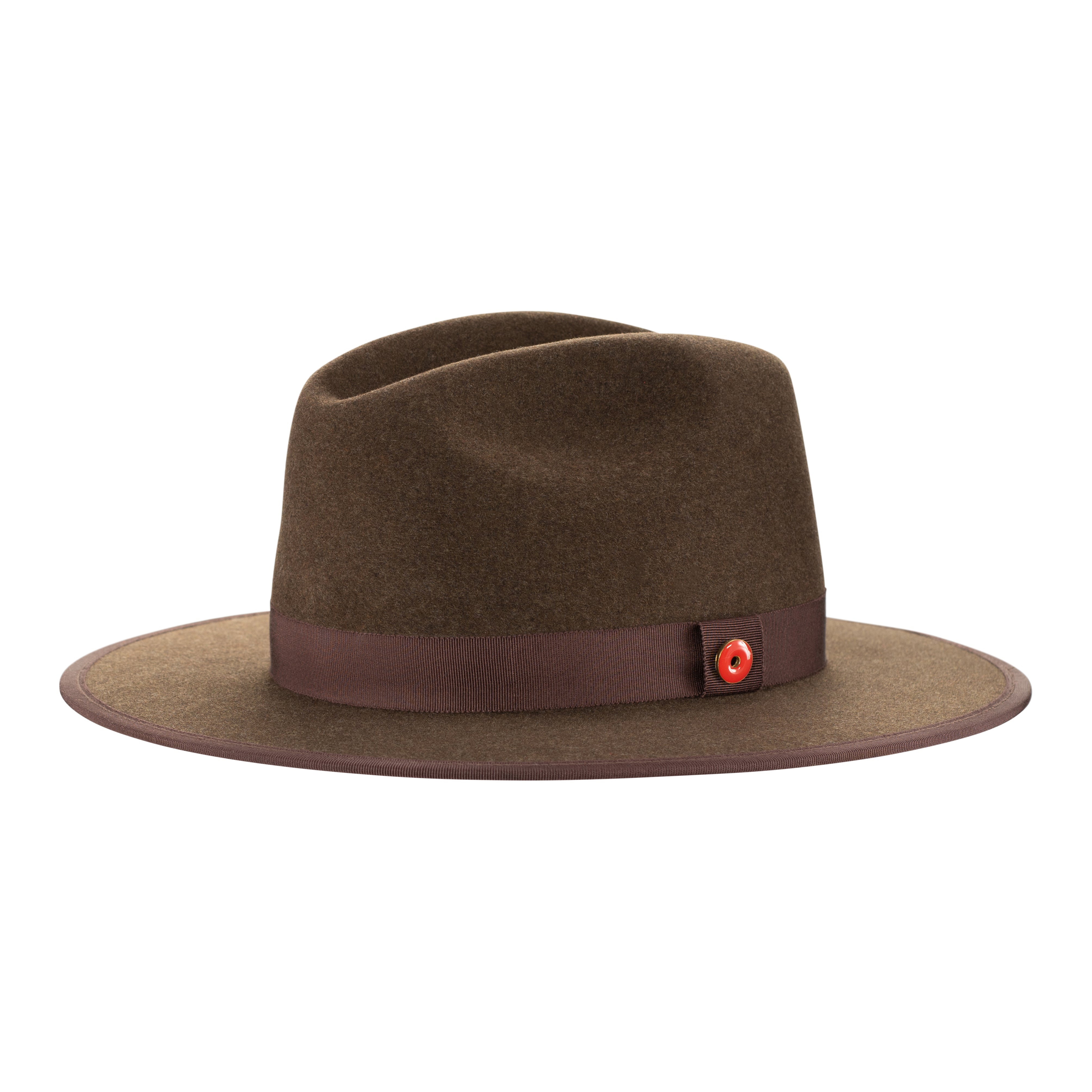A cocoa brown fedora hat with a flat brim and a classic ribbon trim, featuring a signature logo pin on the crown and a red bottom brim.