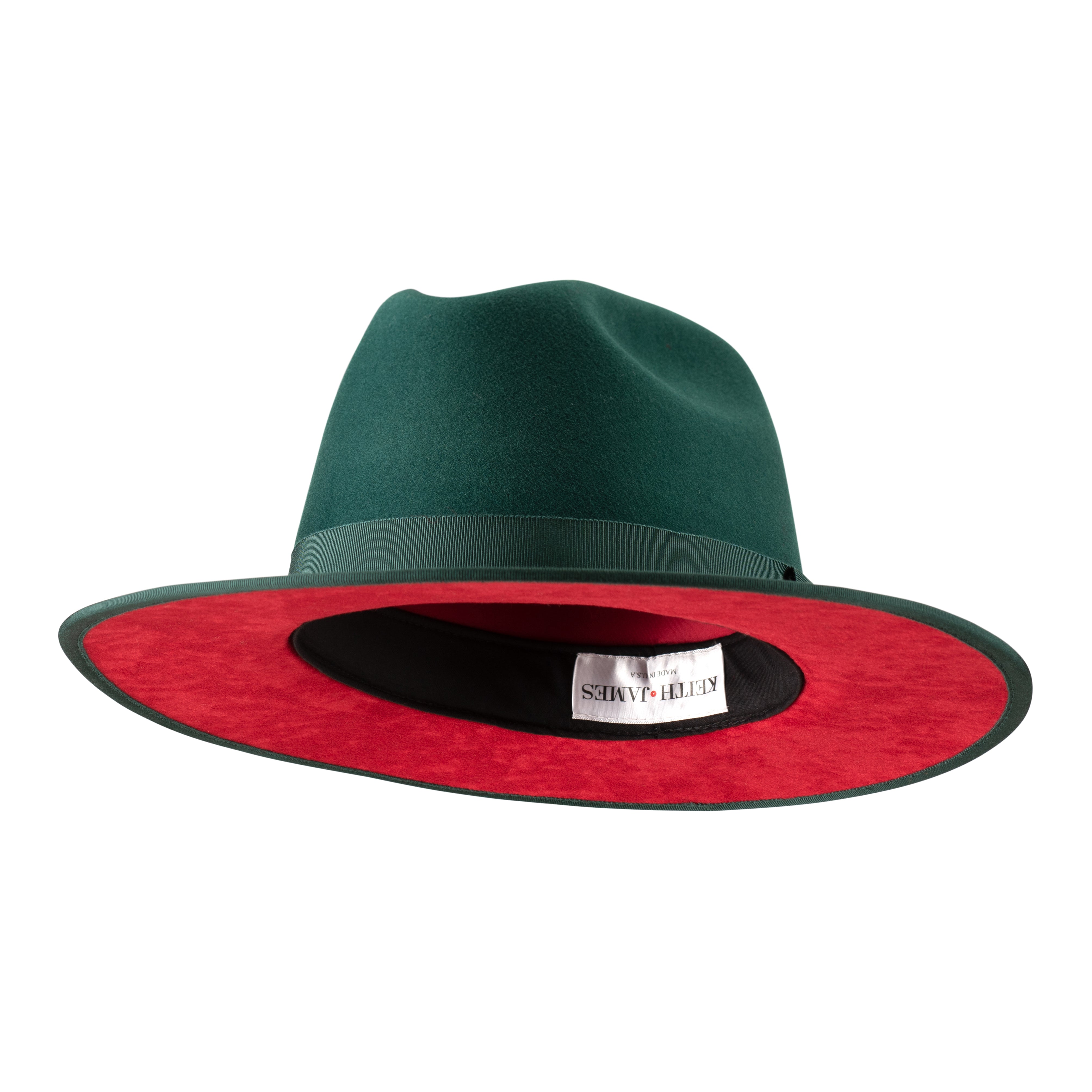 A green fedora hat with a flat brim and a classic ribbon trim, featuring a signature logo pin and a red bottom brim.