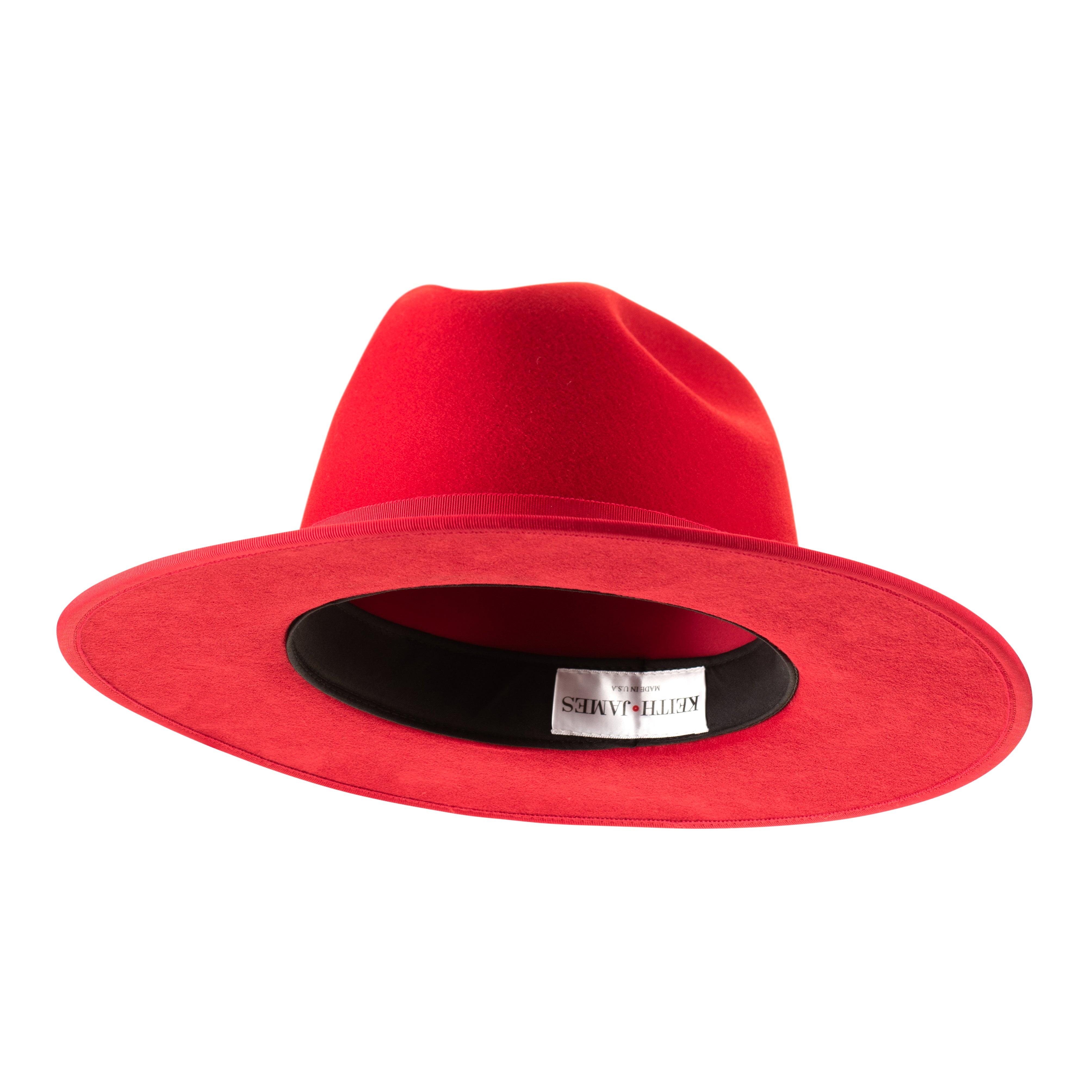 A rose red fedora hat with a pinched crown, flat brim, and bound edge. It includes a classic ribbon trim, a signature logo pin, and a red bottom brim.