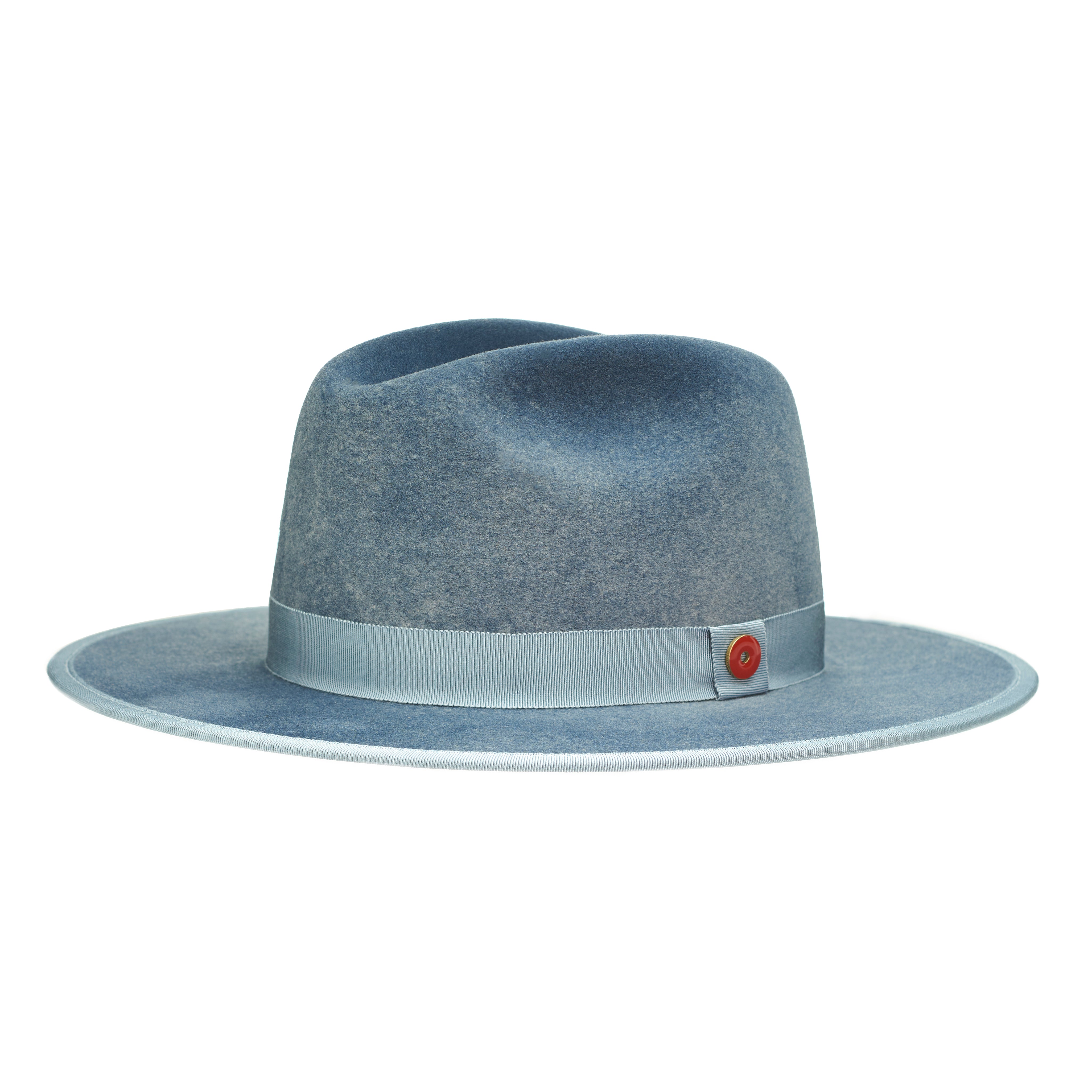 A blue fedora hat with a flat brim and a classic ribbon trim, featuring a signature logo pin and a red bottom brim.