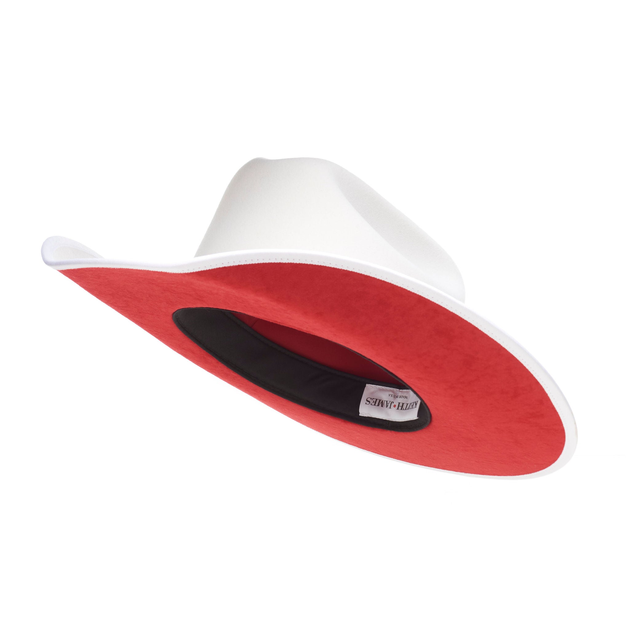 A white Western fedora with a red suede brim and a 'Keith And James' red circle logo pin.